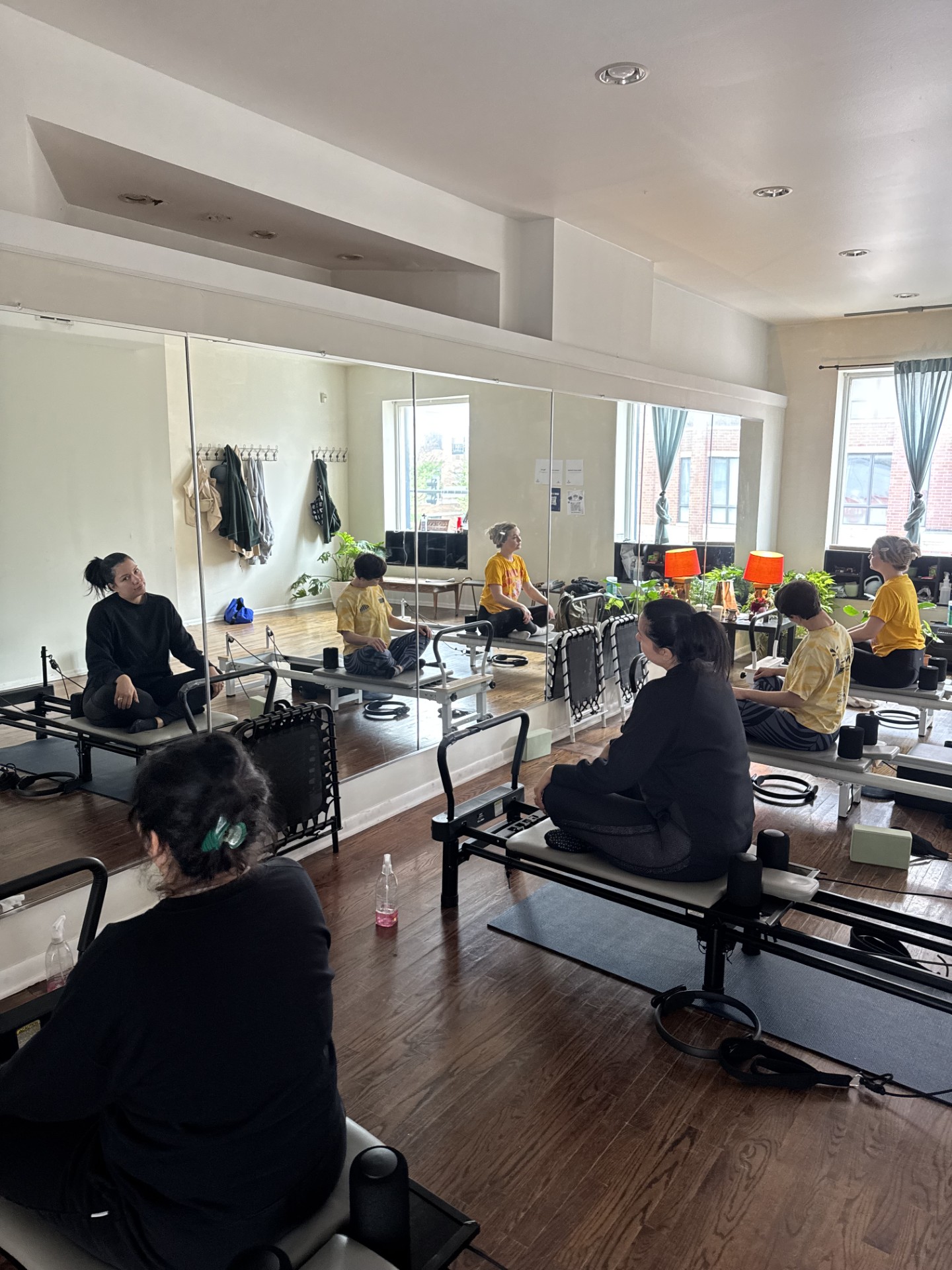 Pilates practitioner stretching on a reformer