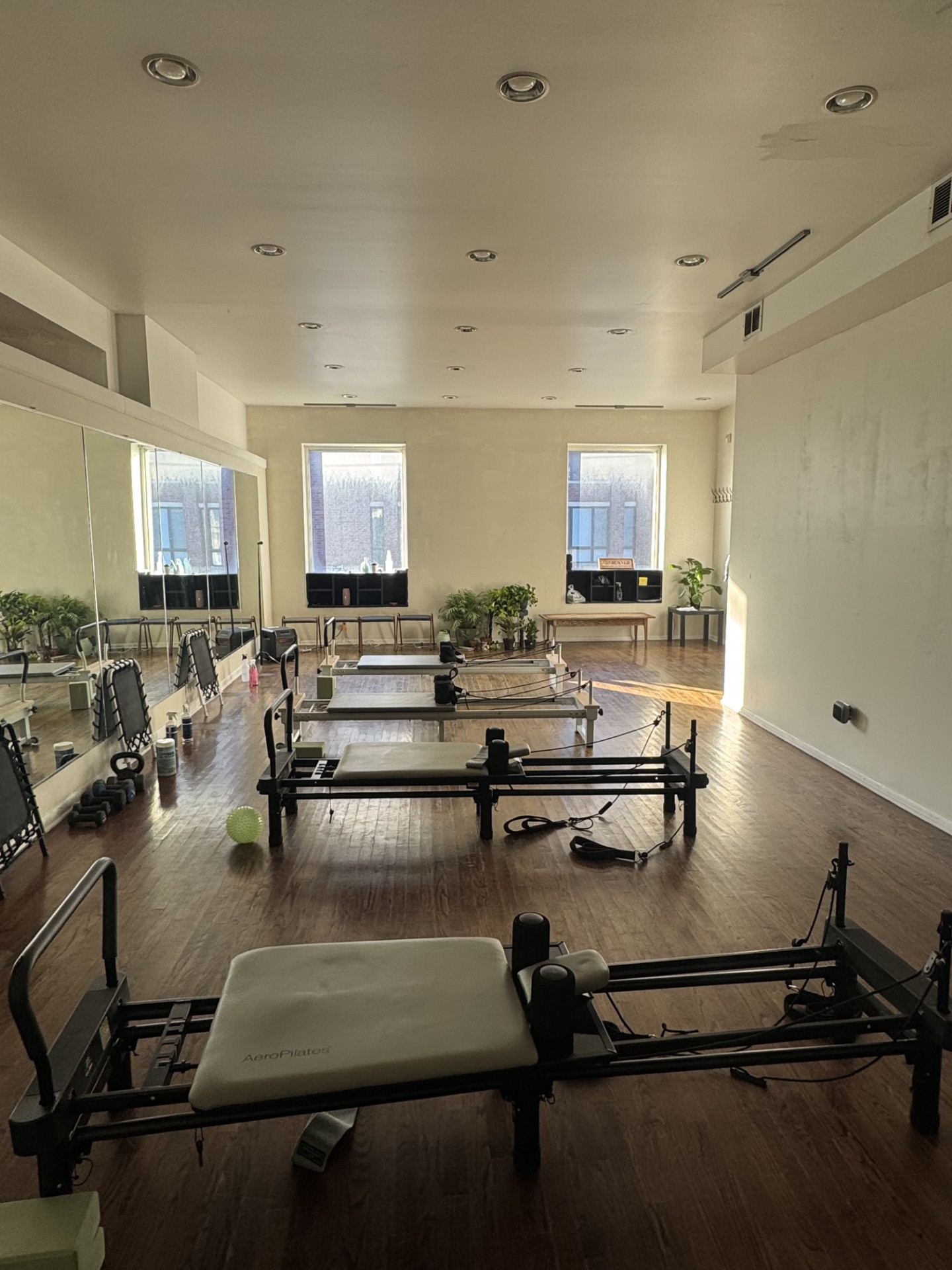 Close-up of hands on a Pilates reformer strap